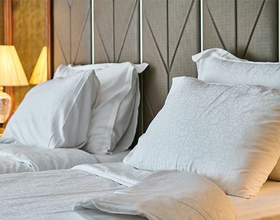 A bed with two pillows.