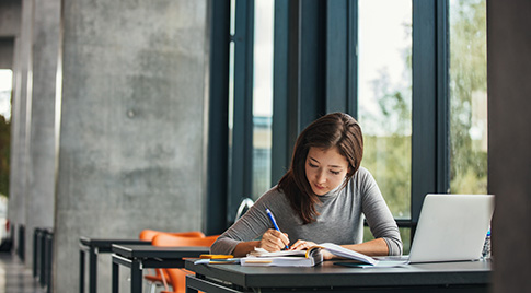 A student studying in their university library